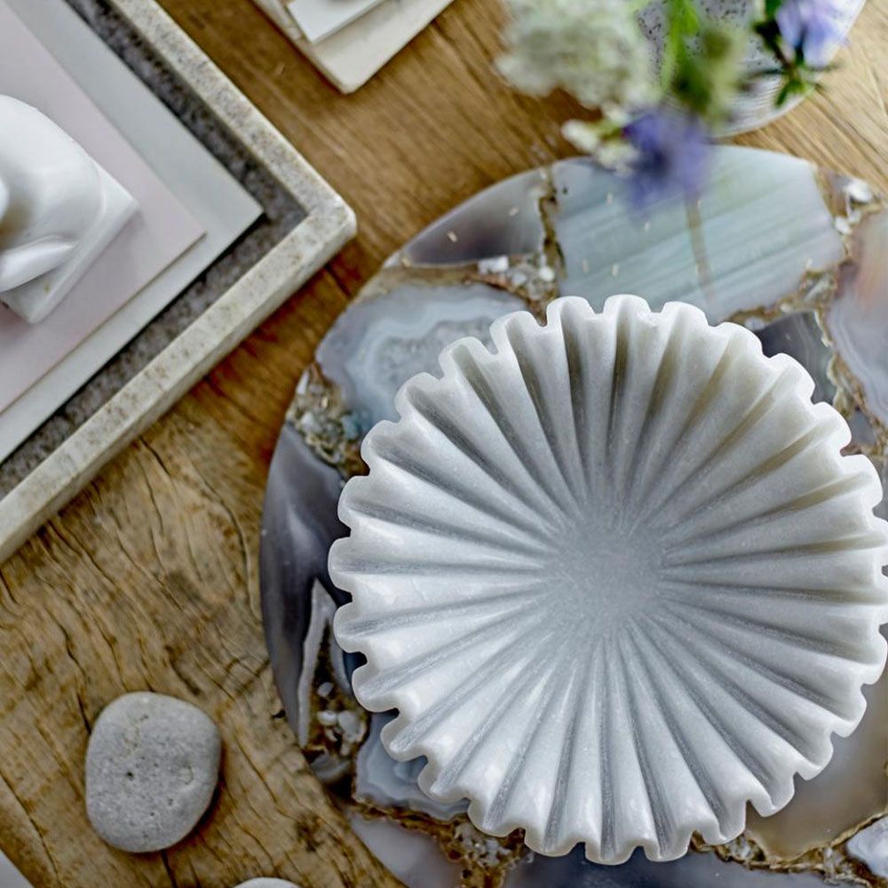 White marble bowl in carved curve design