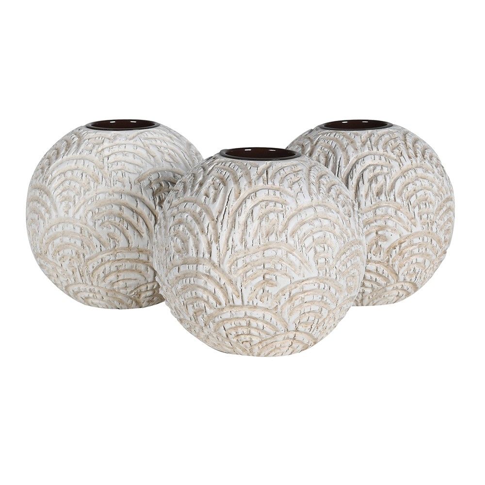  carved-effect round candle holders