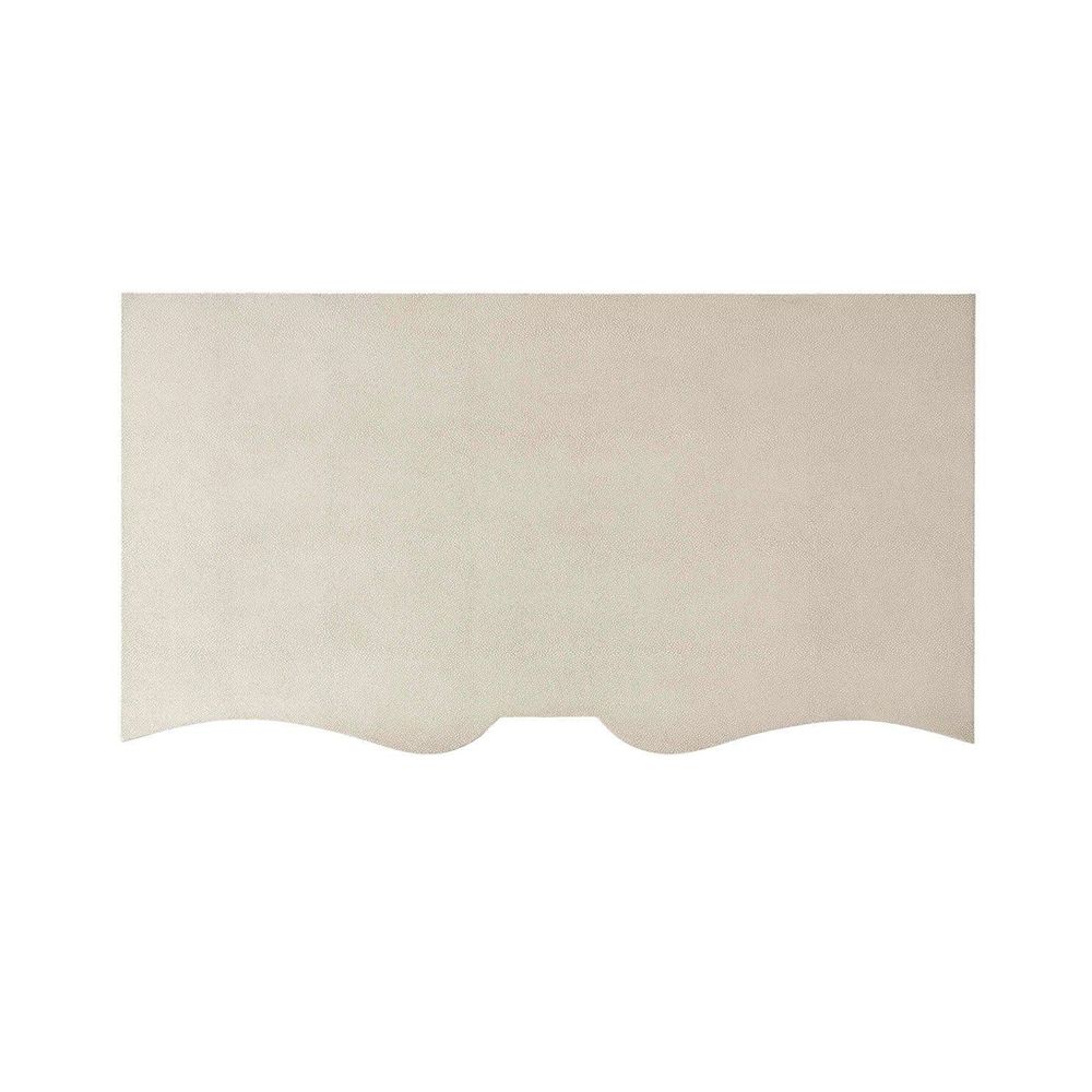 A luxurious chest of drawers with an undulating design, shagreen-embossed leather wrapping and nickel details  