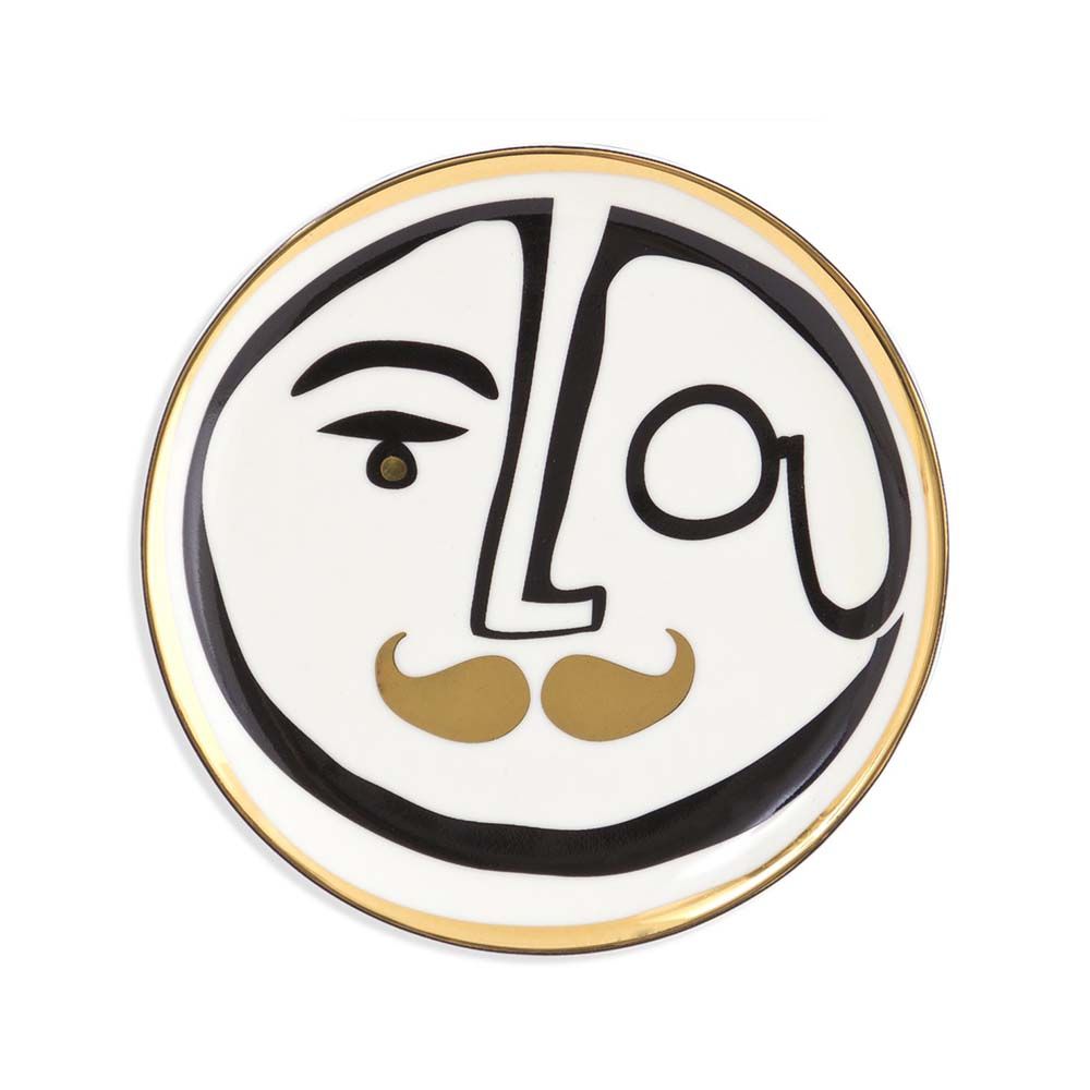 A luxurious set of four porcelain coasters with black, white and gold face designs