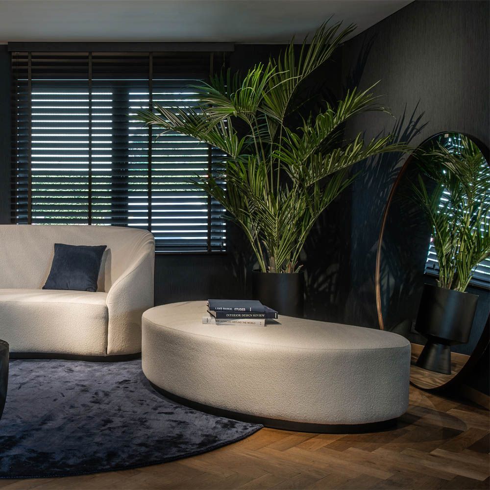 Sumptuously curved stool with a luxurious bespoke upholstery