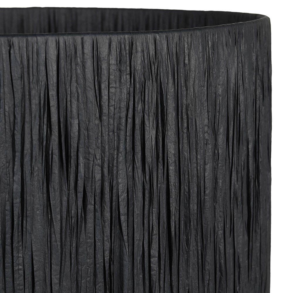 Bold black table lamp with raffia shade