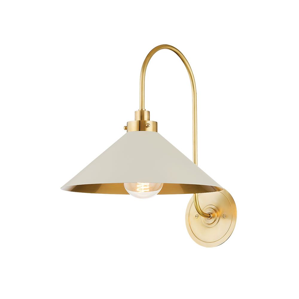 Delicate wall scone with golden fixture and classic cone shaped shade