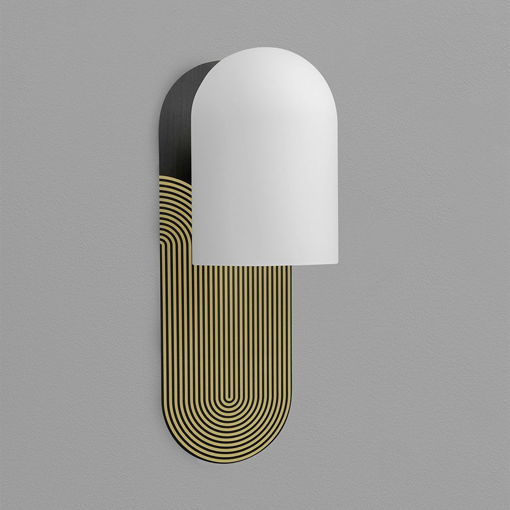 Wall sconce with a linear design engraved fitting and misted glass shade