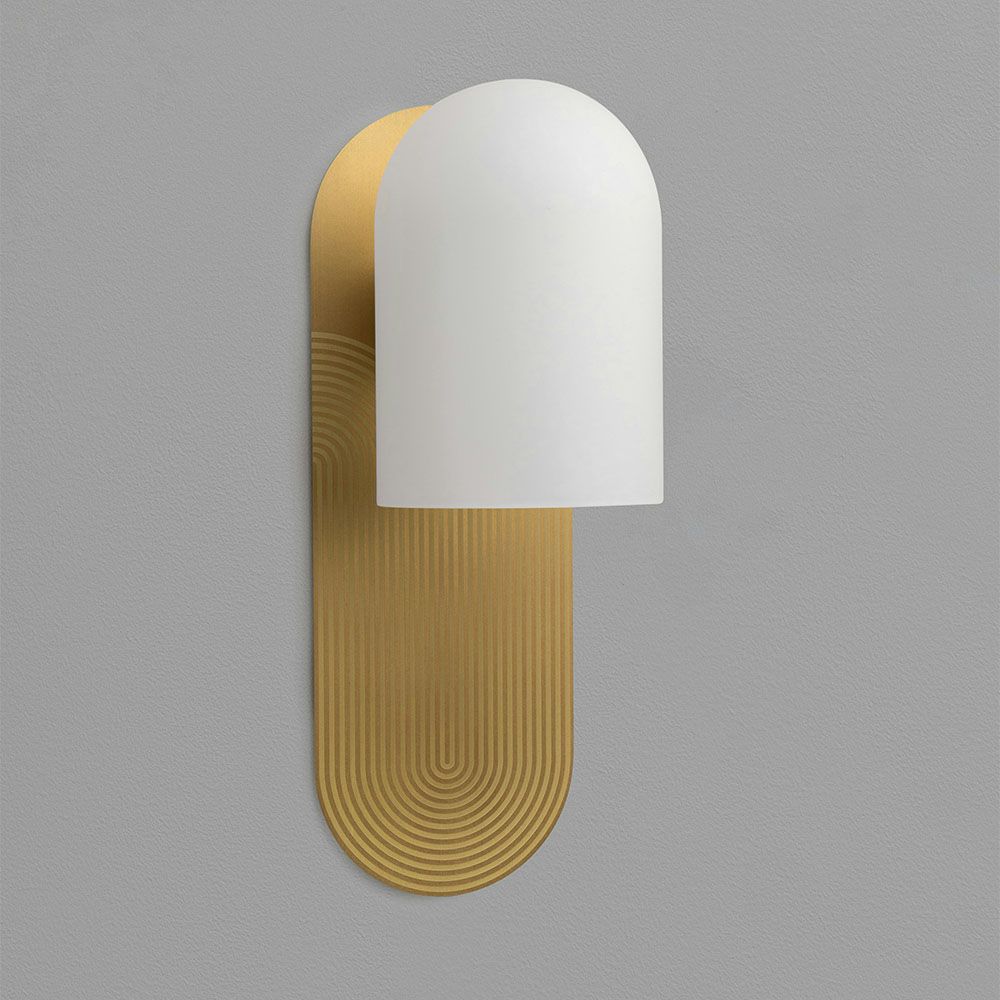 Wall sconce with a linear design engraved fitting and misted glass shade