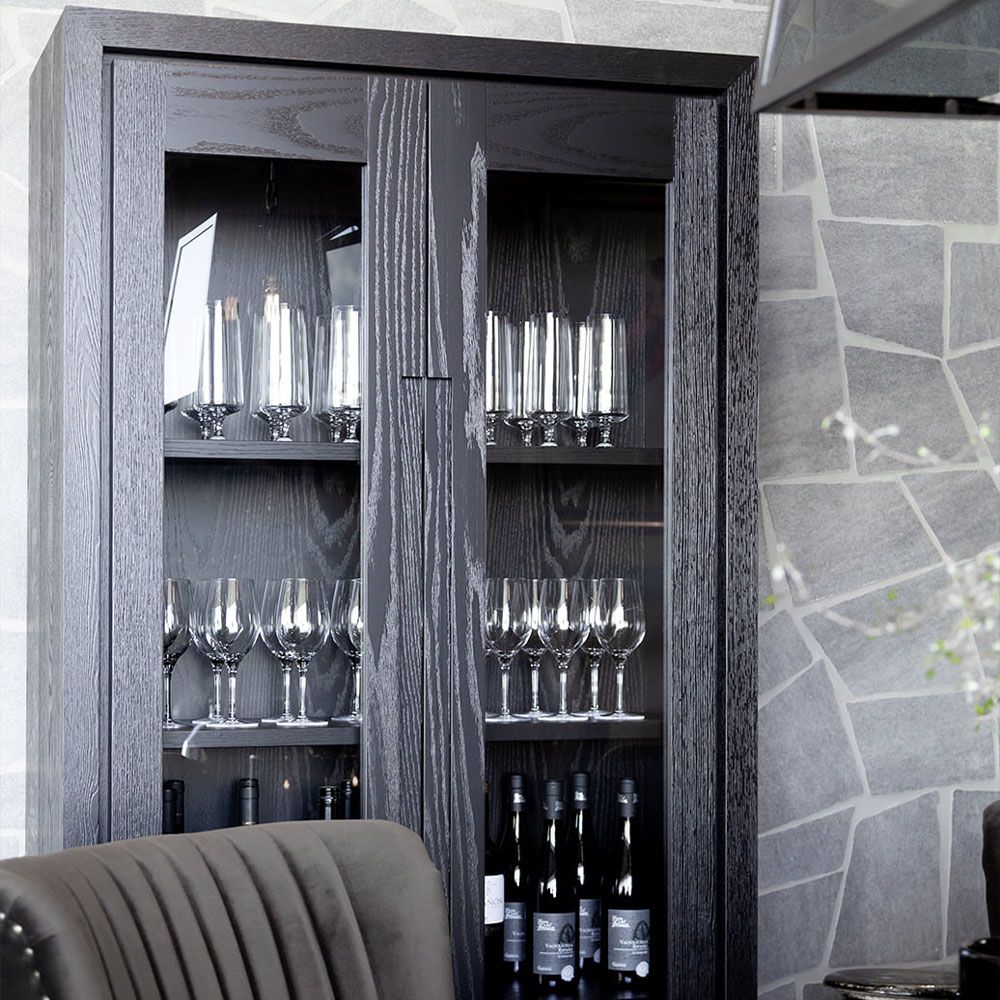 Black cabinet with four shelves and glass fronted doors