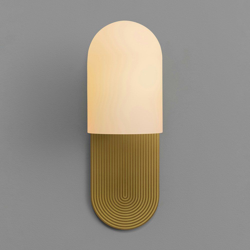 Wall sconce with a linear design engraved fitting and misted glass shade