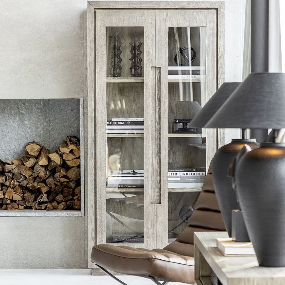 Grey cabinet with four shelves and glass fronted doors