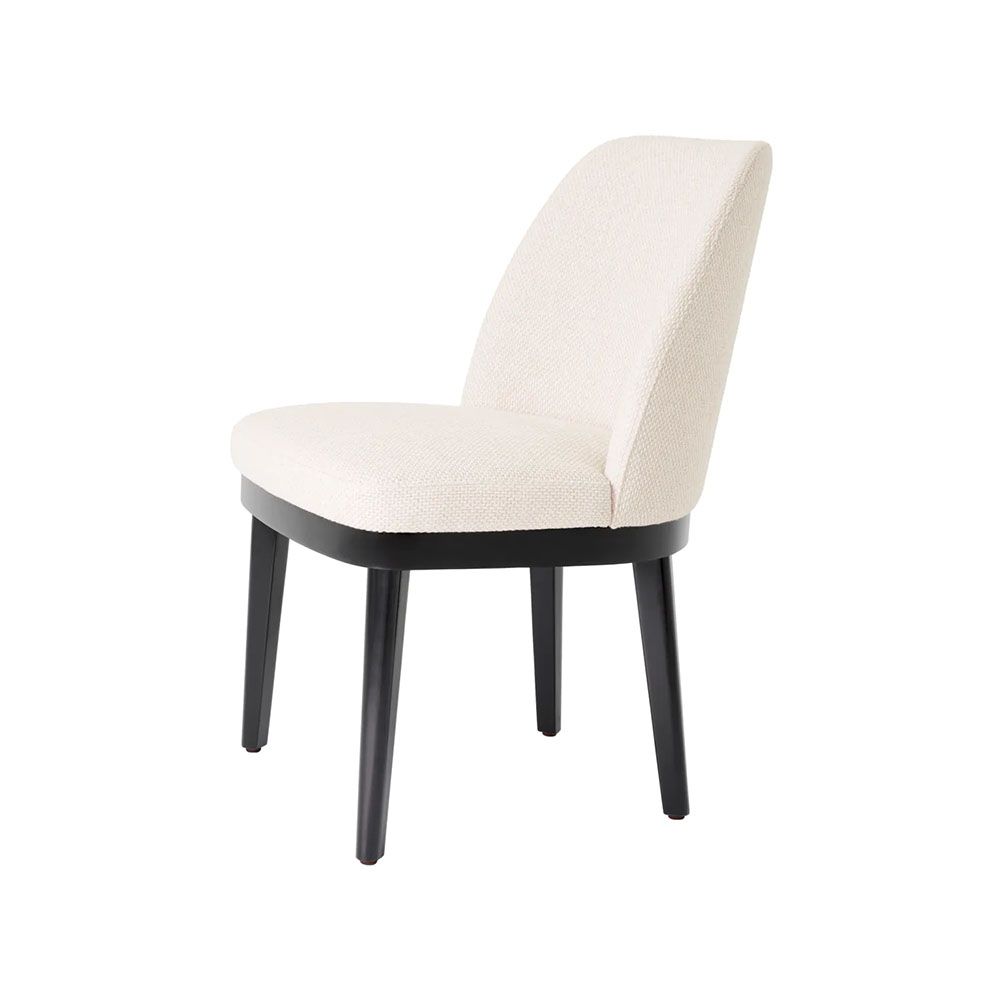 A stylish dining chair with a luxury Pausa Natural upholstery and sophisticated black frame