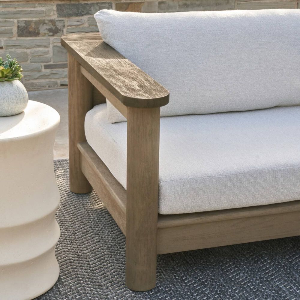 Elevate your outdoor space with the Caldwell Outdoor Sofa in Porpoise Boucle. Stylish, durable, and comfortable for any gathering. Relax in luxury!