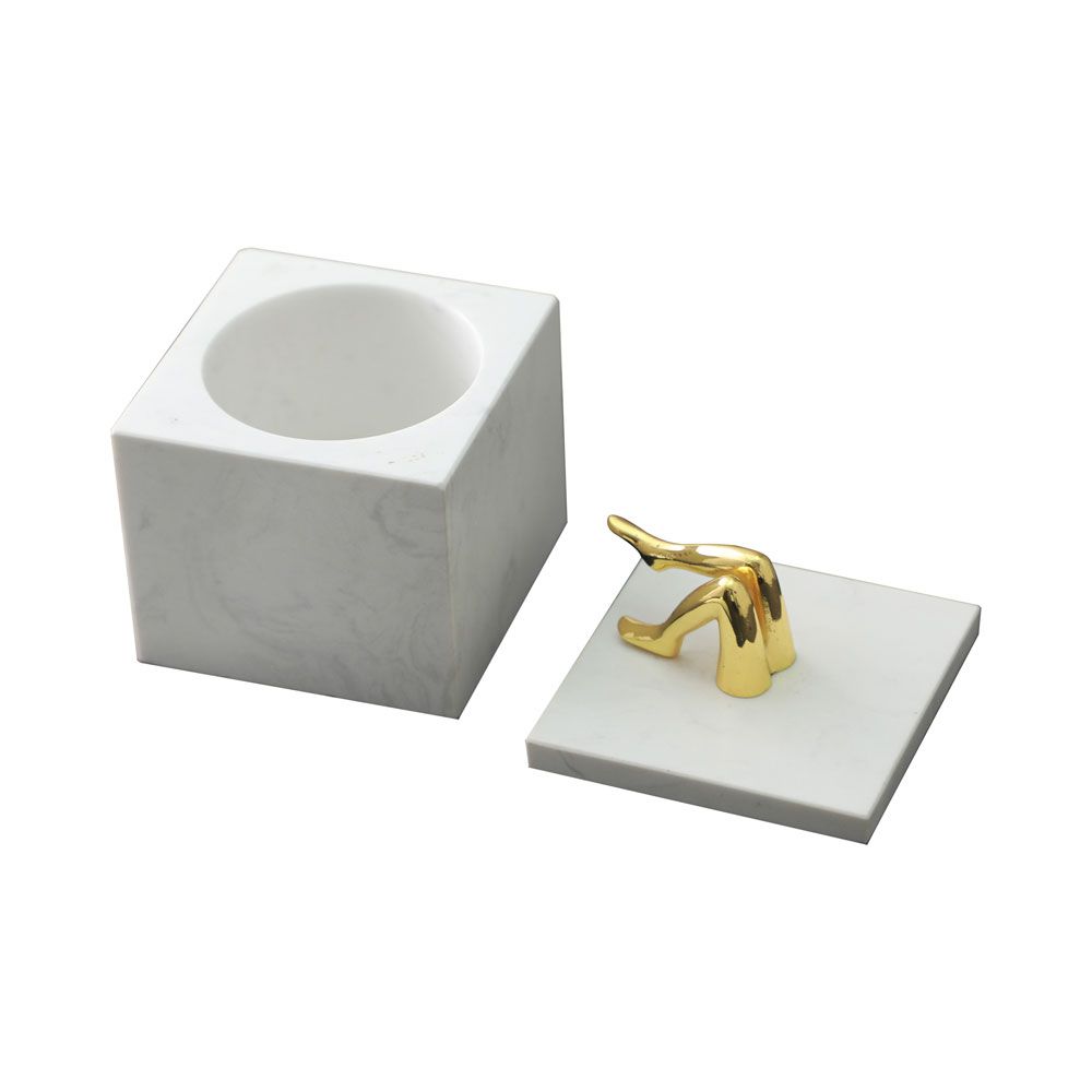 White marble storage jar with brass legs detail on top