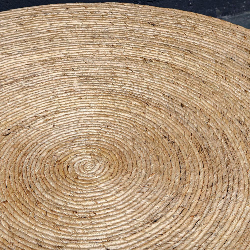 Round coffee table covered in natural rope weave