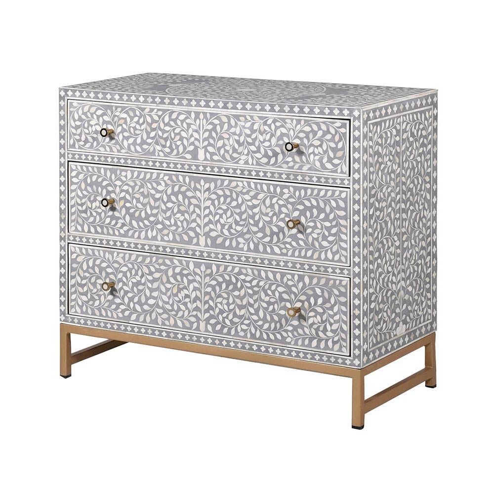 A gorgeous bone inlay chest of drawers with a stainless steel base 