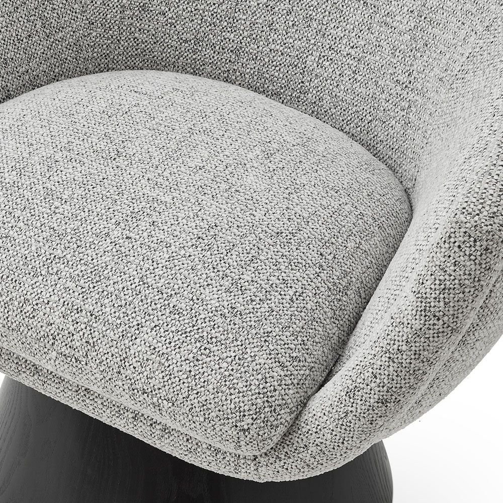 A captivating occasional chair with a gorgeous grey upholstery and cone base