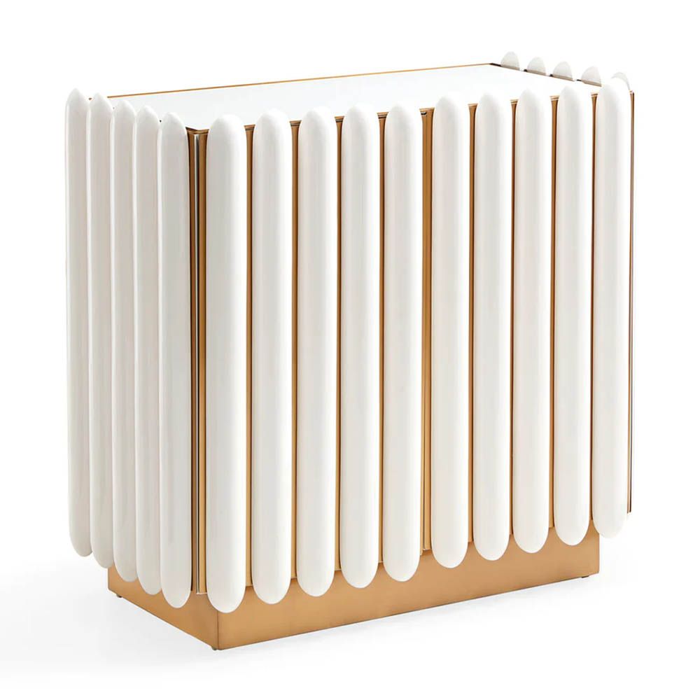 A retro-futuristic inspired cabinet in an ivory finish and brass base