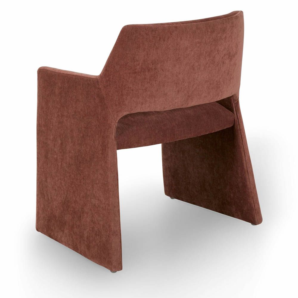 Rust dining chair with large tapered legs and wrap-around back