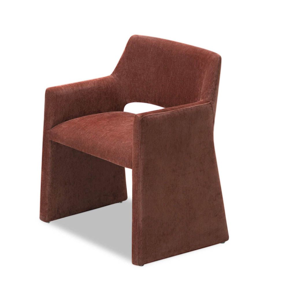 Rust dining chair with large tapered legs and wrap-around back