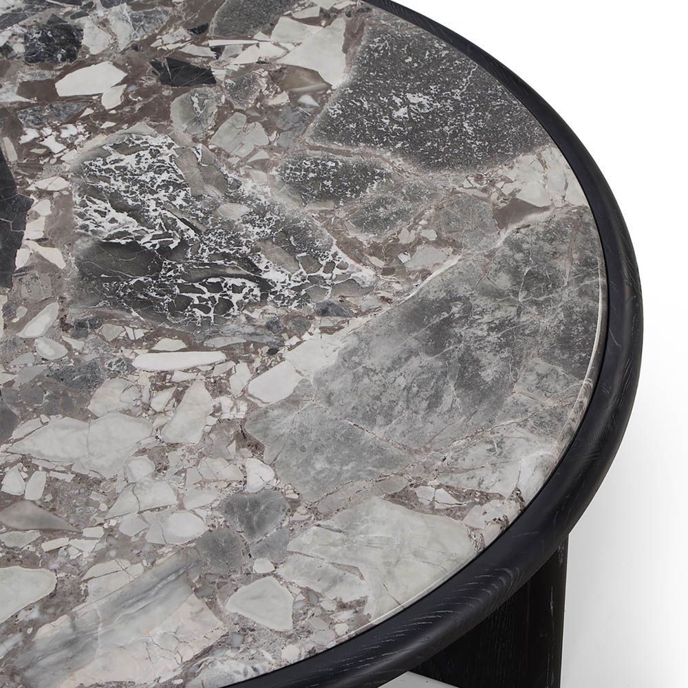 Round coffee table with grey marble top and matte black ash veneer base