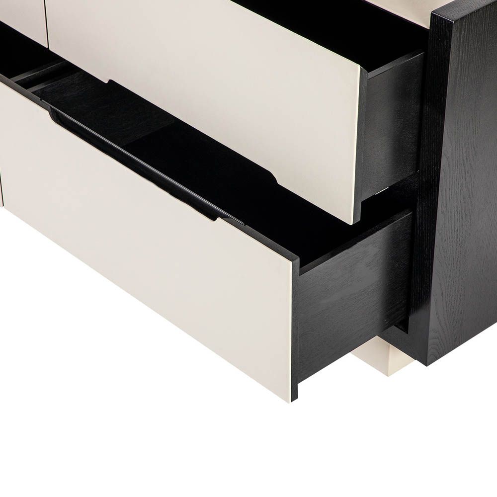 Modern cream coloured chest of drawers with leather front and matte black edges