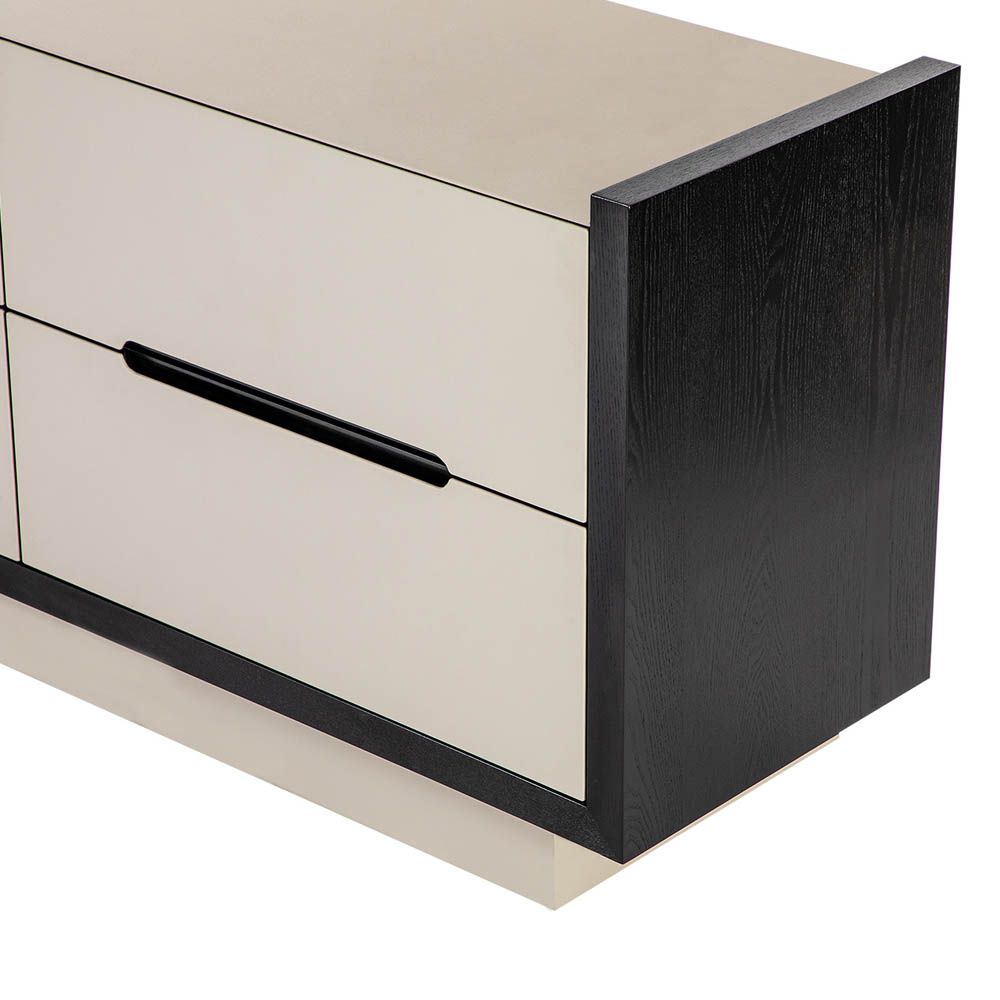 Modern cream coloured chest of drawers with leather front and matte black edges