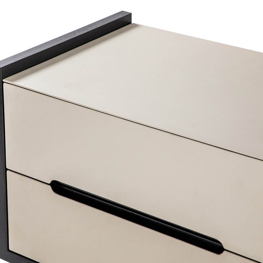 Neutral leather finish two-drawer bedside table with black contrast edges