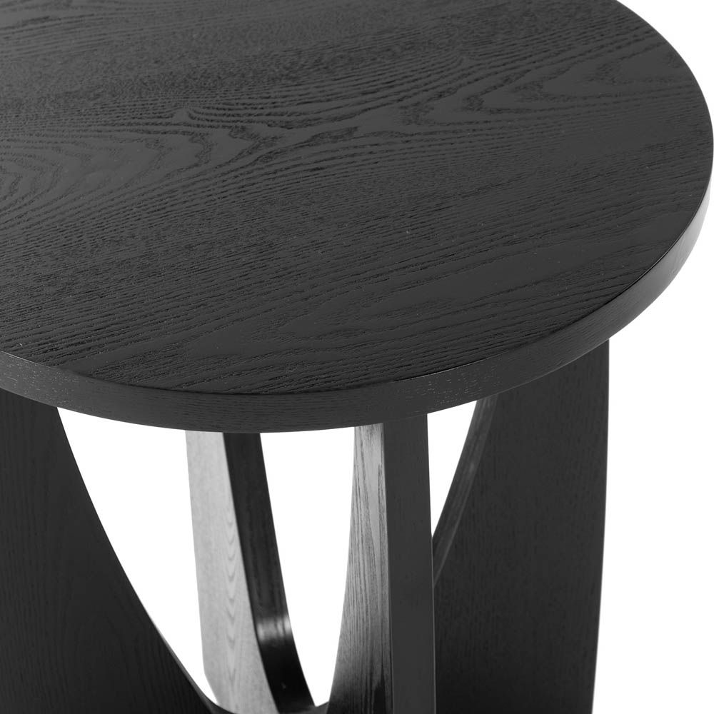 Classic mid-century silhouette side table with curve cut out legs and round top in black wood finish