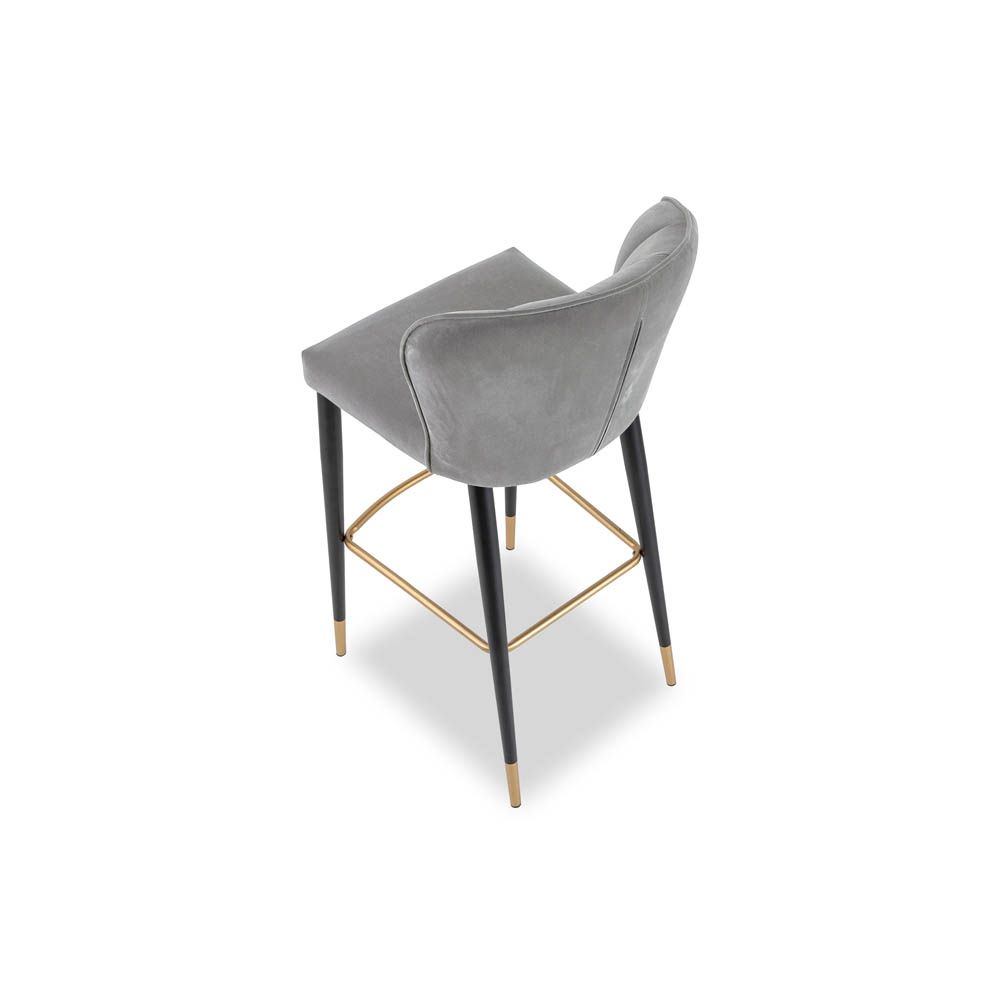 Art-deco inspired bar stool in grey velvet with fluting details and brass accents