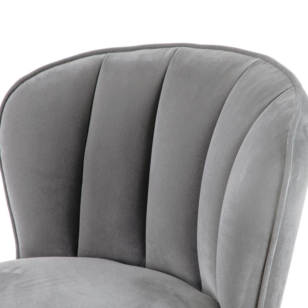 Art-deco inspired bar stool in grey velvet with fluting details and brass accents