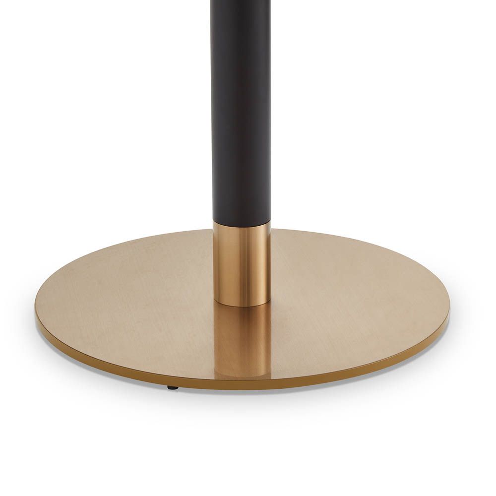 White marble top bar table with brass element at the base