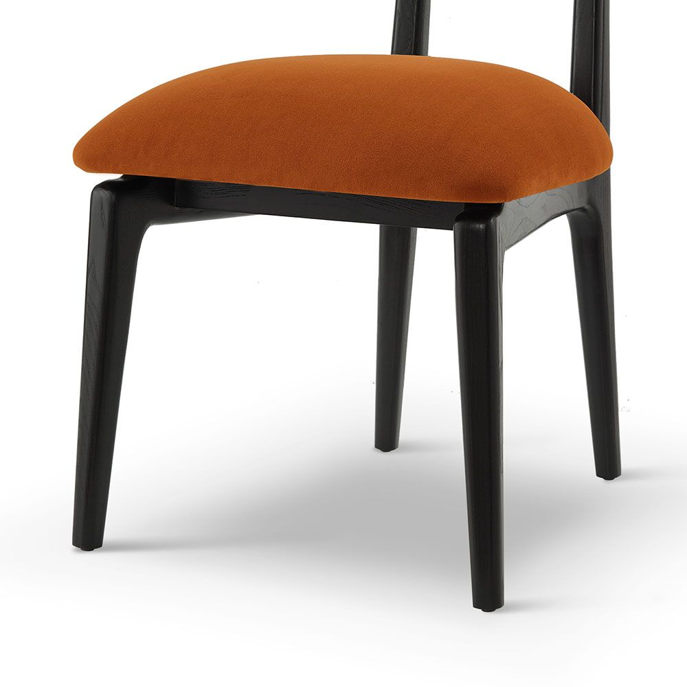 A statement dining chair with a vibrant upholstery