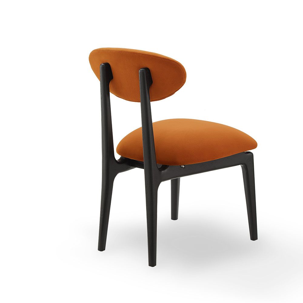 A statement dining chair with a vibrant upholstery
