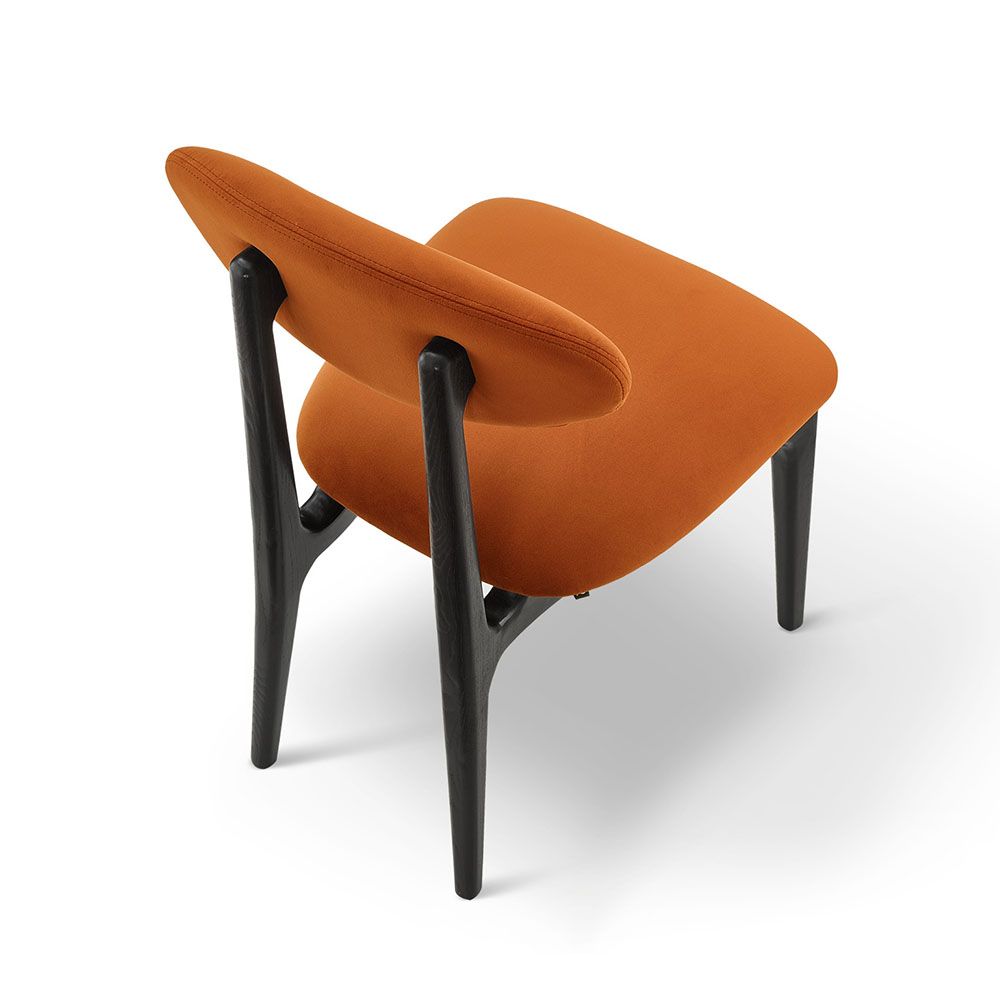 A statement dining chair with a vibrant upholstery