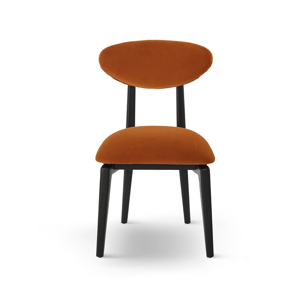 A statement dining chair with a vibrant upholstery