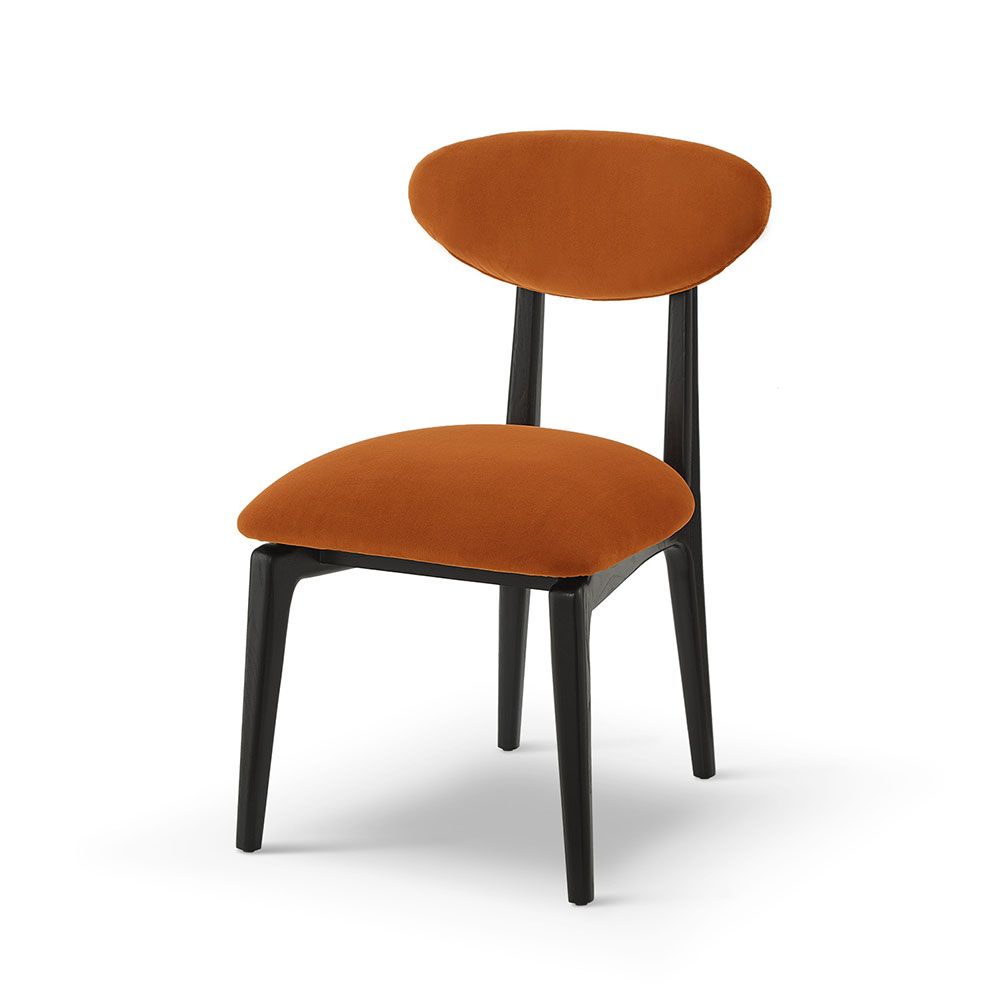A statement dining chair with a vibrant upholstery