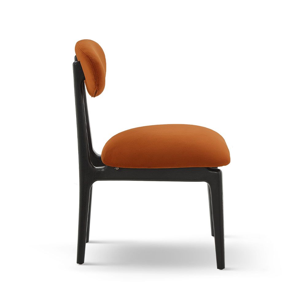 A statement dining chair with a vibrant upholstery