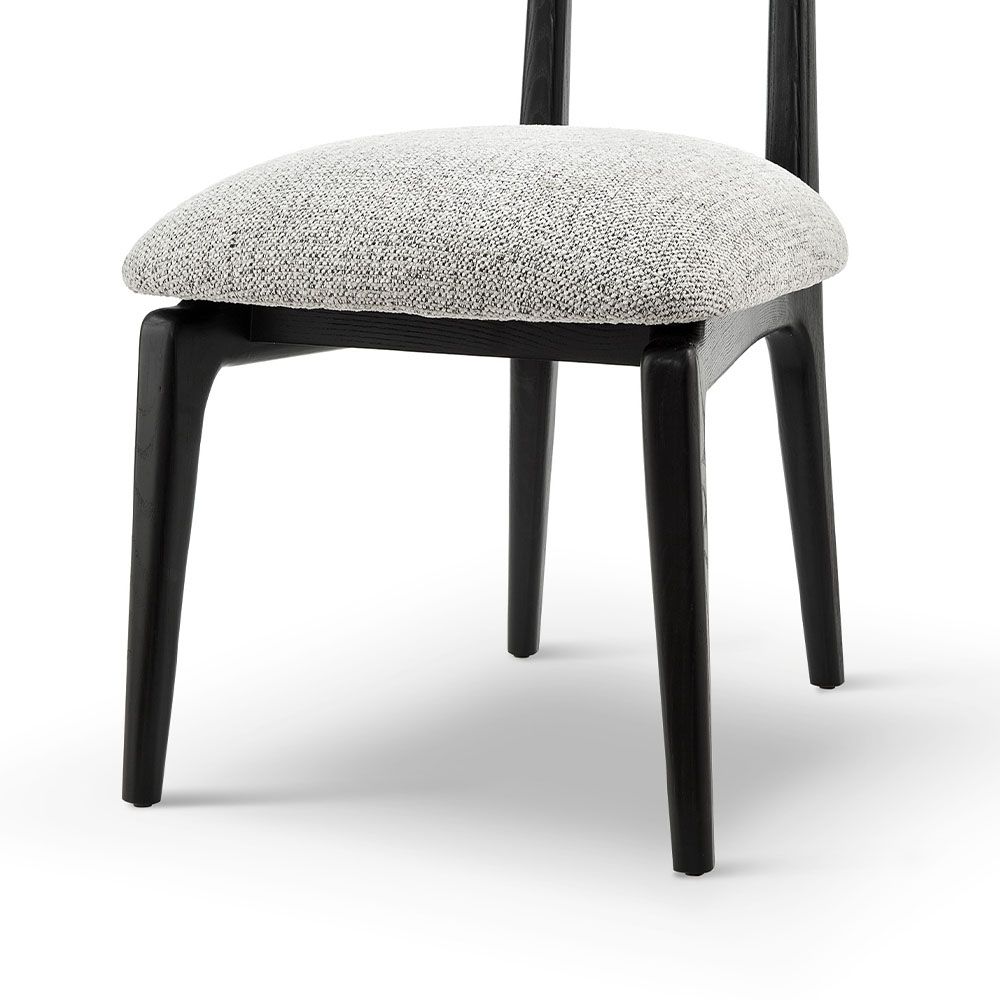A statement dining chair with a gorgeous grey upholstery