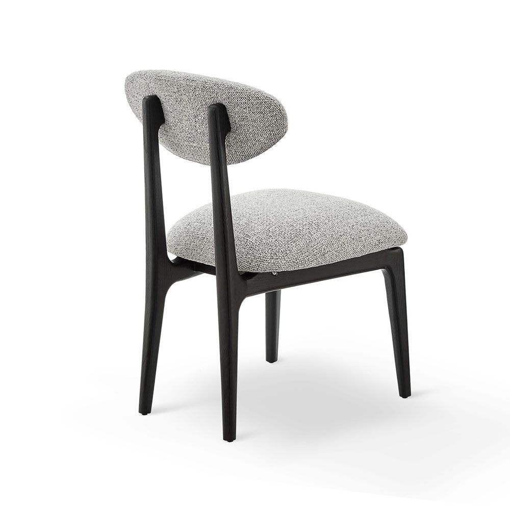 A statement dining chair with a gorgeous grey upholstery