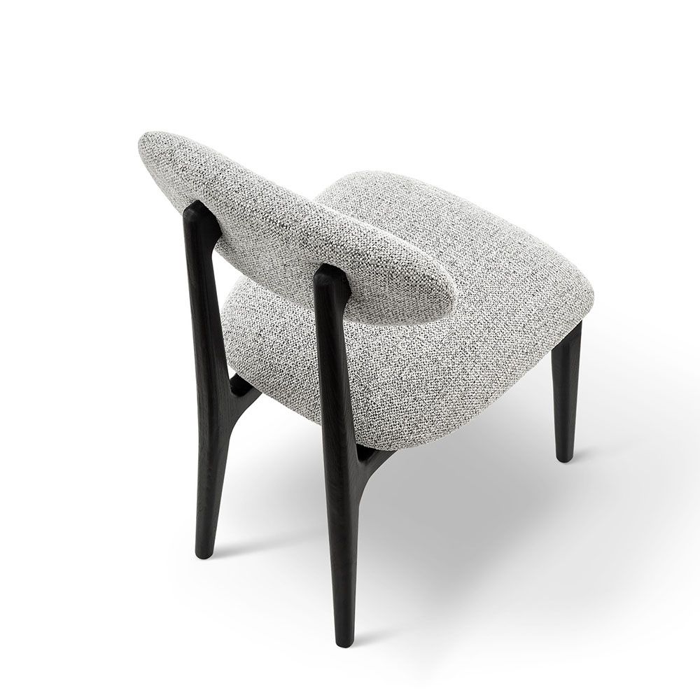 A statement dining chair with a gorgeous grey upholstery