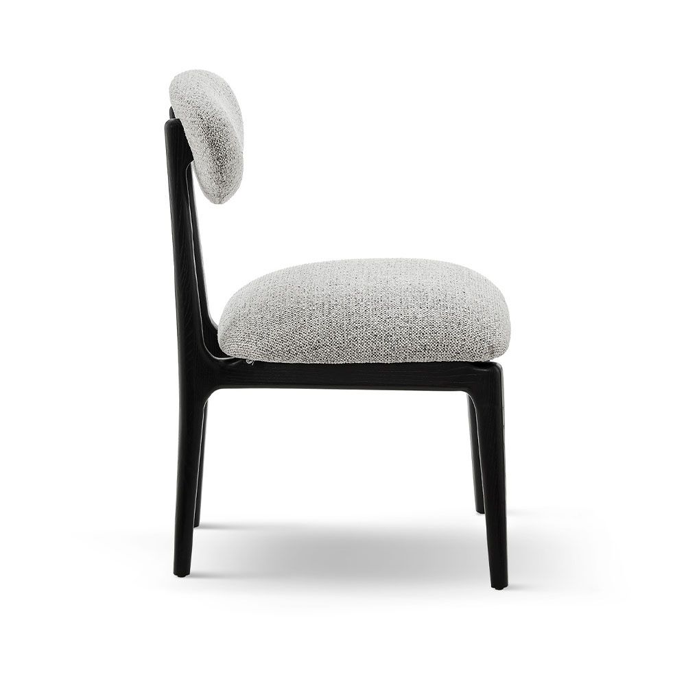 A statement dining chair with a gorgeous grey upholstery
