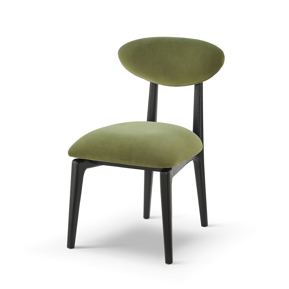 A statement dining chair with a gorgeous green upholstery