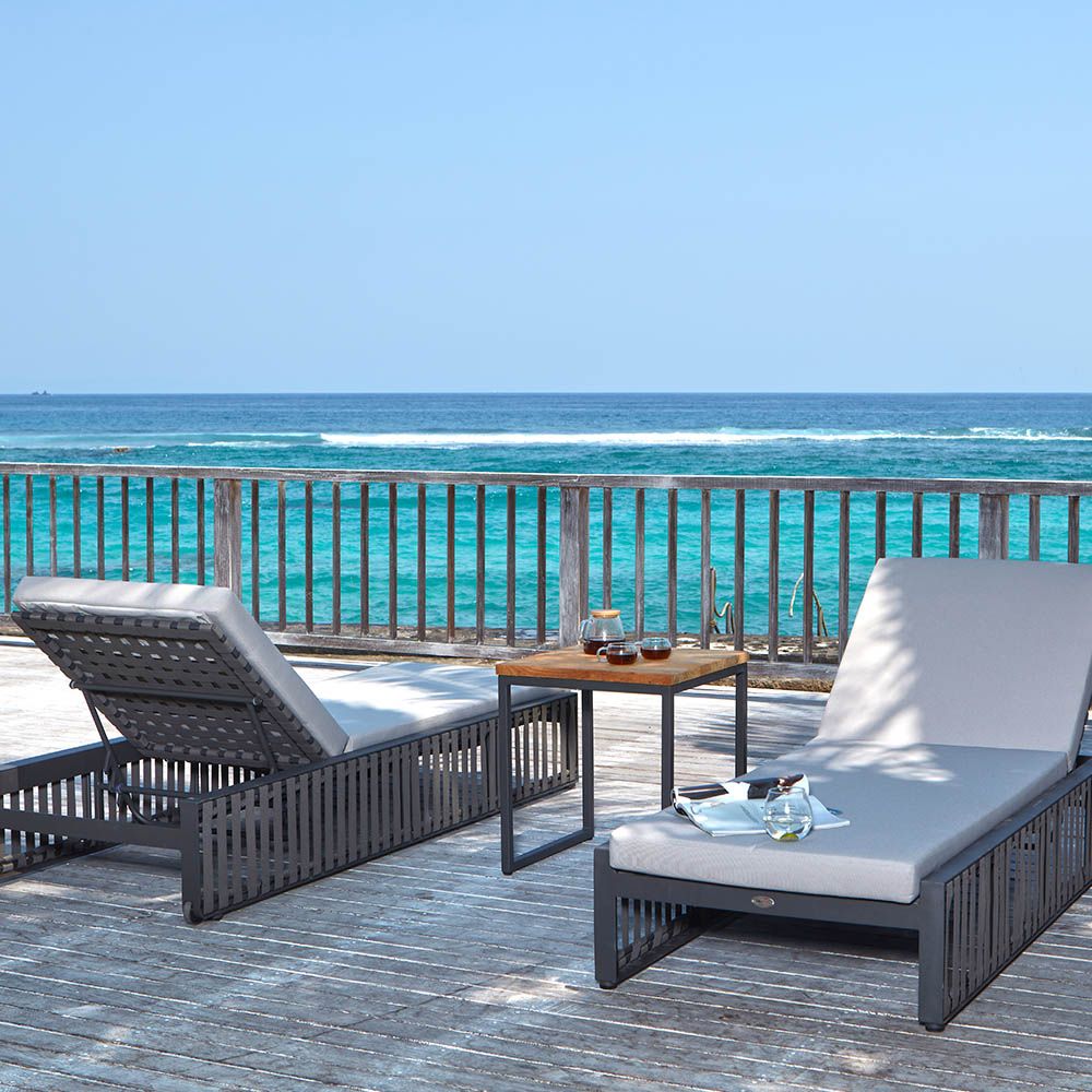 A stylish sun lounger from Willow's Outdoor collection with a bespoke sunbrella upholstery