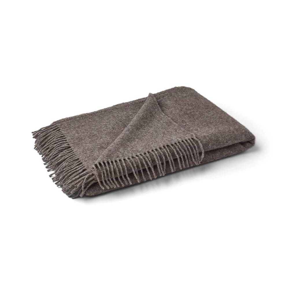 Cosy wool throws in various colour finishes