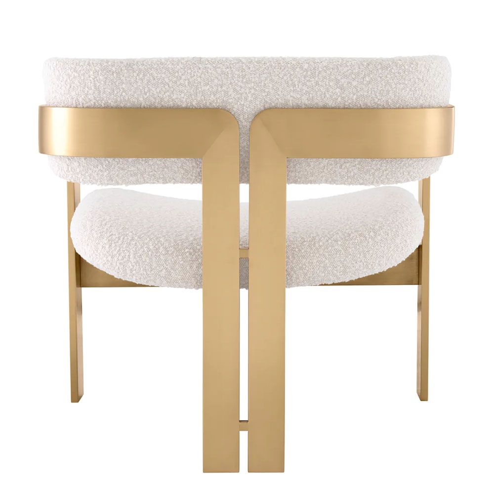 Chair with brushed brass frame and boucle finish seating and back pads