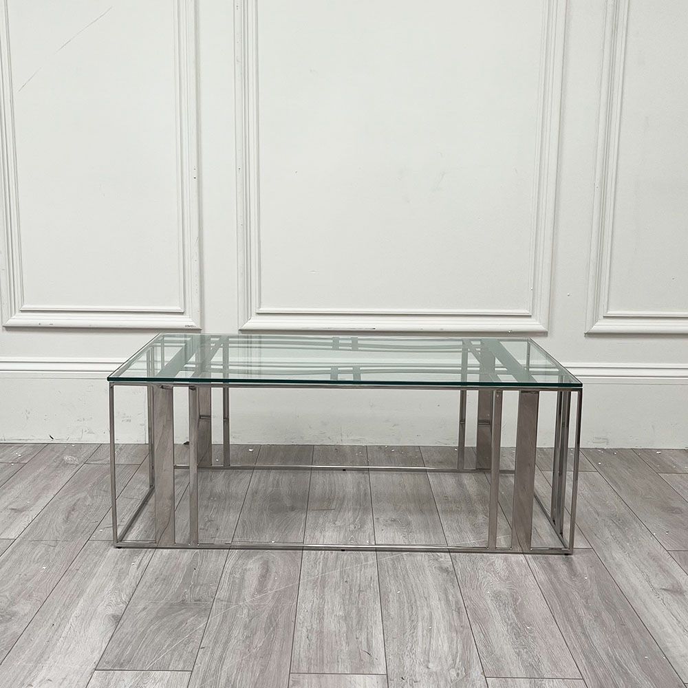 Polished stainless steel coffee table with tempered clear glass surface