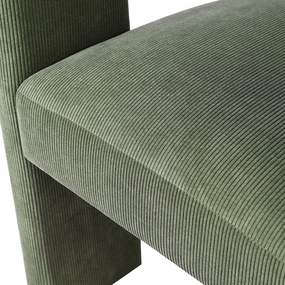 Trending three-legged corduroy dining chair in olive green