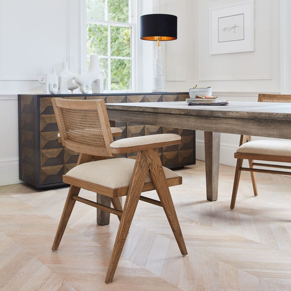 A Scandinavian-inspired natural ash canned armchair with linen padding 