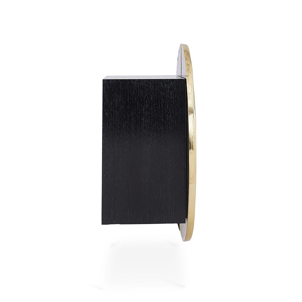A stylish hand-hammered brass bar cabinet with polished brass legs and interior shelving