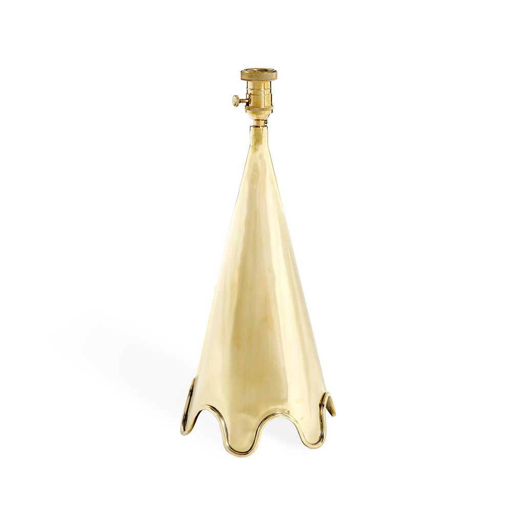 A luxurious, solid polished brass table lamp with a rippled base and a white shade