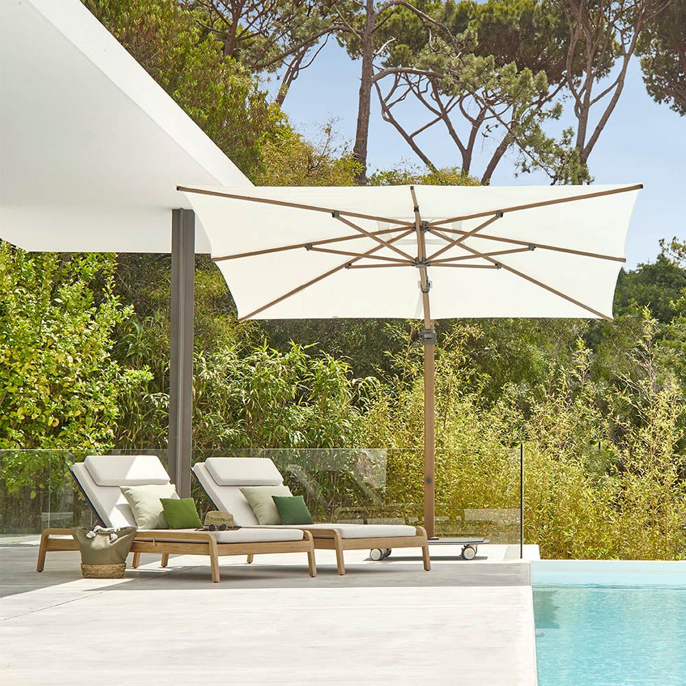 A gorgeous sun lounger from Skyline Design with a lovely natural frame and beautiful sunbrella upholstery 