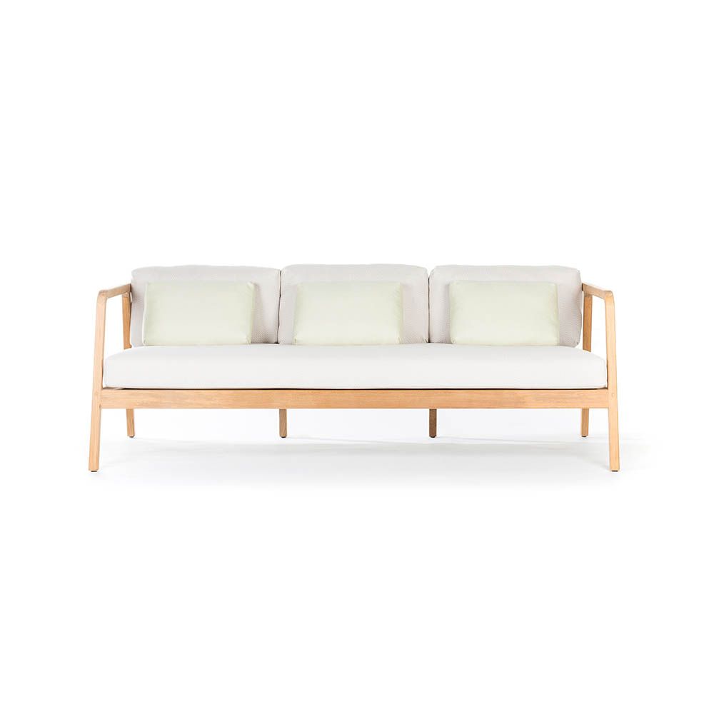 A stylish outdoor sofa from Skyline Design with a dreamy off-white sunbrella upholstery 